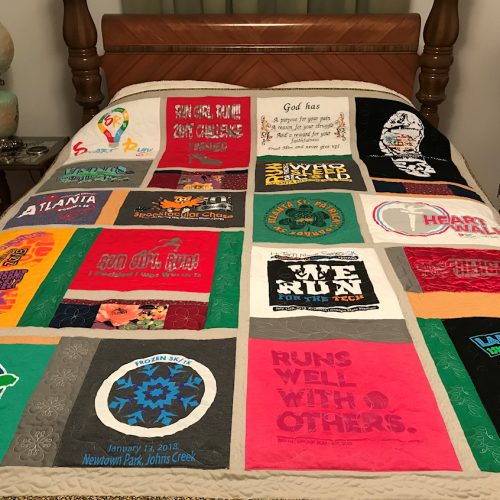 Loretta has been training and participating  in marathons.  Using the t-shirts of all the events, I created this memory quilt or reminder quilt of all she has acomplished.