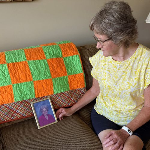 Susan with photo of Mom